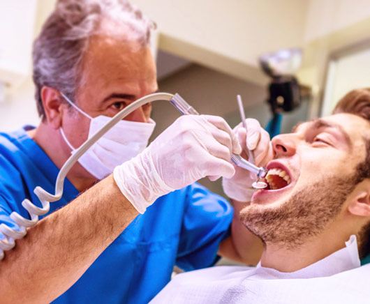 Man in the dentist chair stock image