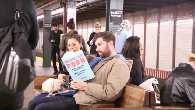 WATCH This Man Riding The Subway With Fake Book Covers Will Make You
