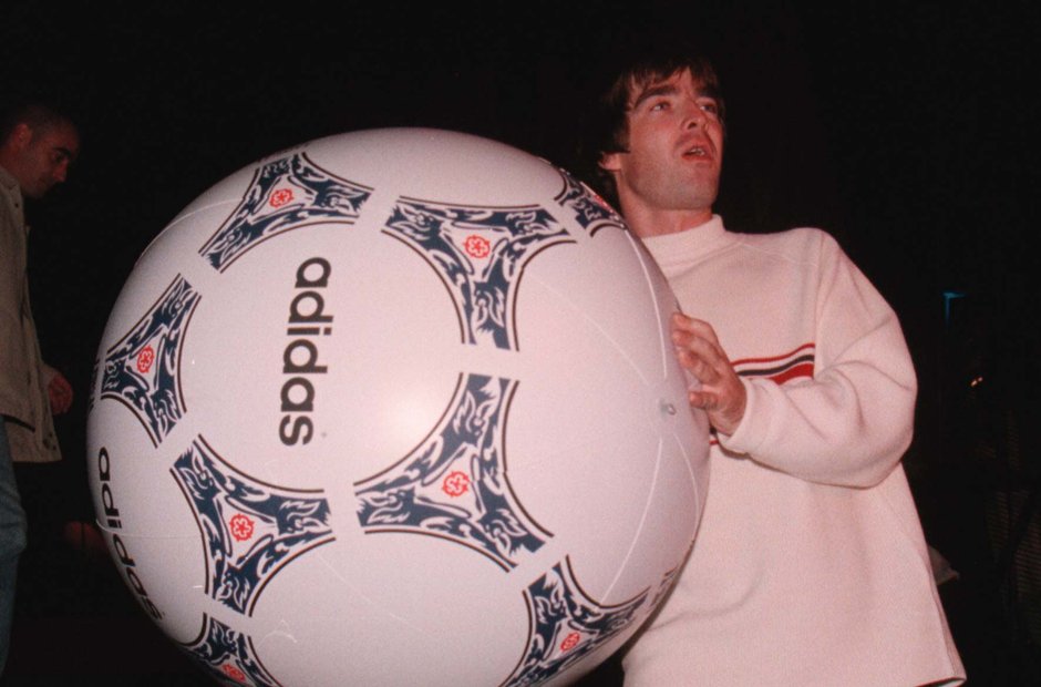 Noel Gallagher and an enormous football onstage at Knebworth