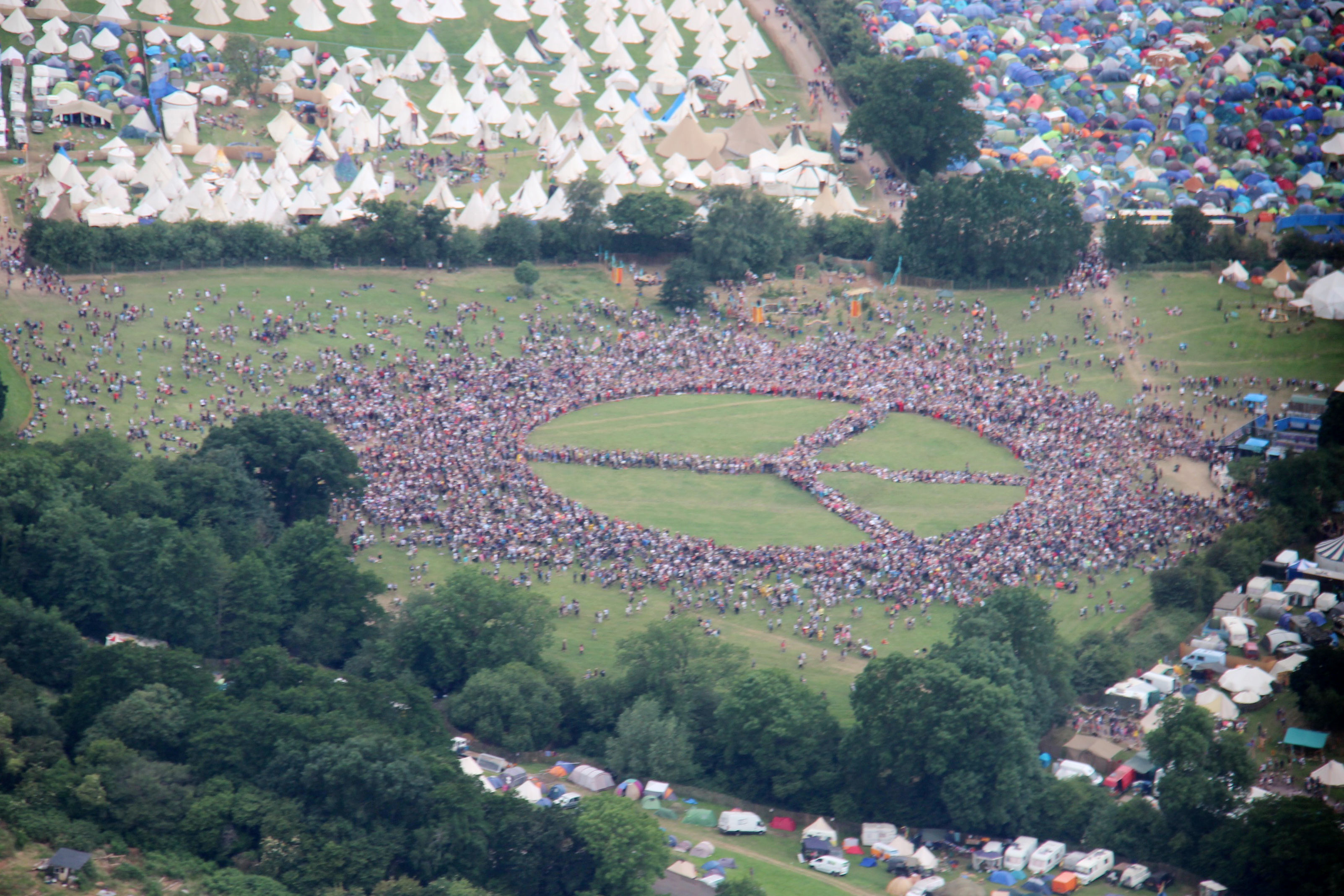 WATCH: 15,000 People Create Biggest Peace Symbol At Glastonbury - Radio X